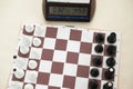 Chessboard and white figures. Blur and selective focus.