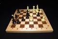 Chessboard and white pieces like a strategy theme Royalty Free Stock Photo