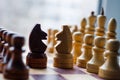 Chessmen on a chessboard, white background, Chess pieces on a chessboard