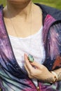 chest detail in space jacket with labradorite pendant on silver chain Royalty Free Stock Photo