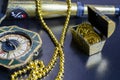 Chest with gold coins, a pirate necklace on a black background Royalty Free Stock Photo