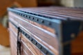 Solid teak chest. Wooden storage chest with lift gas spring. Close-up Royalty Free Stock Photo