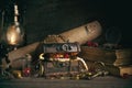 A chest with pirate treasures and jewels on a wooden table in the captain`s cabin in retro style, the concept of adventure and tre