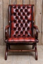 Chesterfield Slipper Chair in oxblood leather Royalty Free Stock Photo