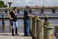 A rocker man with his girlfriend on a dock