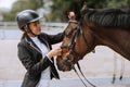 Chestnut horse together with her favorite owner young teenage girl. Colored outdoors horizontal summertime image Royalty Free Stock Photo