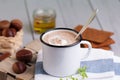 Chestnut soup in white enamel mug with roasted chestnuts Royalty Free Stock Photo