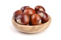 Chestnut in a wooden bowl isolated on white background. Top view Royalty Free Stock Photo