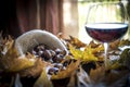 Chestnuts with glass of wine Royalty Free Stock Photo