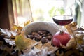 Chestnuts with glass of wine Royalty Free Stock Photo