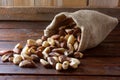 Chestnuts from Para or Brazil nuts, in Portuguese: Castanha-do-ParÃÂ¡ or Castanha-do-Brasil, in the bag on a rustic wooden table Royalty Free Stock Photo