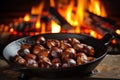 chestnuts roasting on an open fire Royalty Free Stock Photo