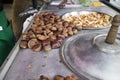 Chestnuts roasting on sidewalk cart