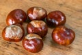 Chestnuts on a rustic wooden background Royalty Free Stock Photo