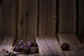 Chestnuts in a wood background composition