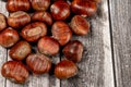 Chestnuts on wooden surface