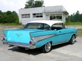 1957 Chevrolet BelAir two door parked by old gas station