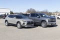 Chevrolet Blazer and Silverado 1500 truck on display at a dealership. Chevy offers a full line of SUVs and pickup trucks