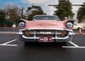 Chevrolet classic car, front view. Pink colour.