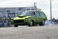 Chevrolet drag car making a smoke show