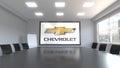 Chevrolet logo on the screen in a meeting room. Editorial 3D rendering