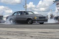 Chevrolet malibu on the track making a smoke show