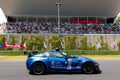 Chevrolet safet car racing on track in front of circuit grandstands Royalty Free Stock Photo