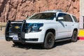 Chevrolet SUV white base model service vehicle wearing U.S. government plates registered to the Department of the Interior