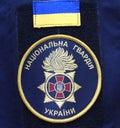Chevron and national flag on a sleeve of a coat of Ukrainian policeman