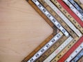 Old folding rulers form a right facing vector representing measurement, metrics and advance or growth