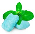 Chewing gum with mint leaves close-up on a white background. Royalty Free Stock Photo