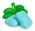 Chewing gum with mint leaves close-up on a white background. Royalty Free Stock Photo