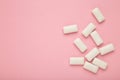 Chewing gum pieces on pink background. Space for text Royalty Free Stock Photo