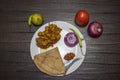 Chhole Roti Plate along with Lemon, Onion, Green Chillies and Tomato Royalty Free Stock Photo