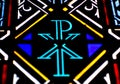 A Chi Rho symbol on a stained glass window