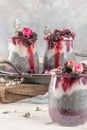 Chia pudding with blackberries and jam in glass jars. Concept of healthy eating, healthy lifestyle, dieting, fitness menu