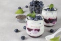 Chia pudding with blueberry and jam in two glass jars gray background, Concept of healthy vegan breakfast Royalty Free Stock Photo