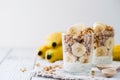 Chia pudding parfait, layered yogurt with banana, granola. Copy space Royalty Free Stock Photo