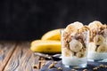 Chia pudding parfait, layered yogurt with banana, granola. Copy space Royalty Free Stock Photo