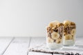 Chia pudding parfait, layered yogurt with banana, granola. Copy space Royalty Free Stock Photo