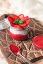 Chia pudding with strawberries in small bowls on a linen tablecloth