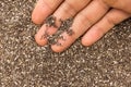 Chia Seed. Person with grains in hand. Macro. Whole food.