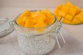 Chia seed pudding with fresh mango in glass jar ready to eat . Concept of healthy eating, healthy lifestyle, dieting, fitness menu Royalty Free Stock Photo