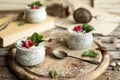 Chia seed pudding with raspberries chocolate and mint in jars. Royalty Free Stock Photo