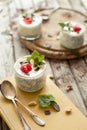 Chia seed pudding with raspberries chocolate and mint in jars. Royalty Free Stock Photo
