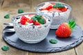 Chia seed pudding with strawberries, almond and chocolate cookie crumbs Royalty Free Stock Photo