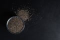 Chia seeds in a cup beautifully laid out on a black background. Top view. copy space. Vegetarian food Royalty Free Stock Photo