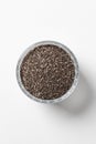 Chia seeds in a cup beautifully laid out on a white background. Top view. Vegetarian food Royalty Free Stock Photo