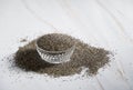 chia seeds in a cup and scattered around the table, abundance, ingredient Royalty Free Stock Photo