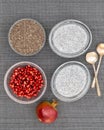Chia seeds in a glass bowl, Chia seed pudding, and pomegranate seeds, close up view from above Royalty Free Stock Photo